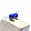 Close-up of lapis lazuli stones set in 925 silver earrings